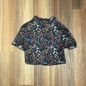 Small cropped mesh flowery top. Great for clubs & parties!